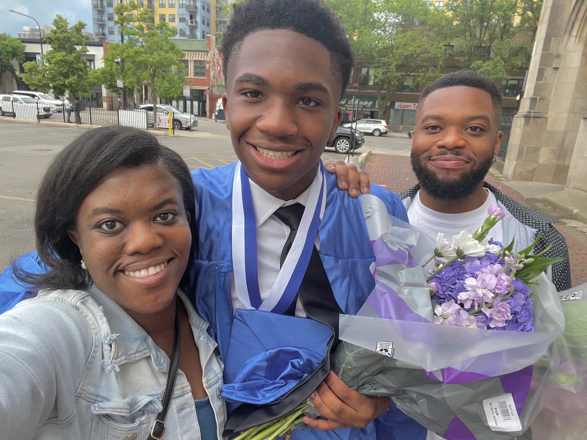JoJo at 8th grade graduation with siblings